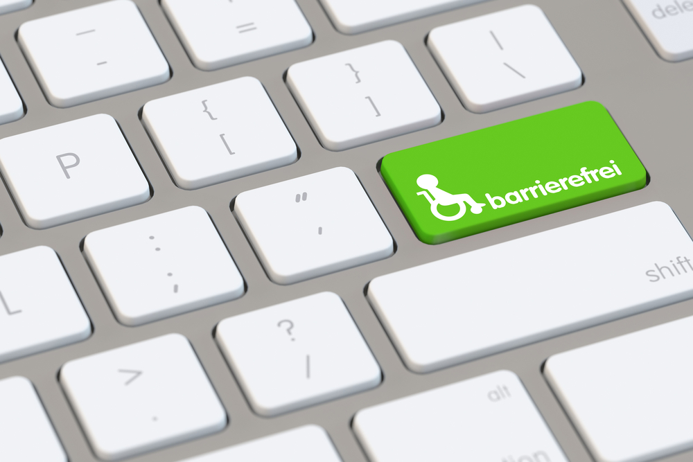 Tastatur mit einem grünen Button, auf dem ein Rollstuhl Symbol ist und "barrierefrei" steht