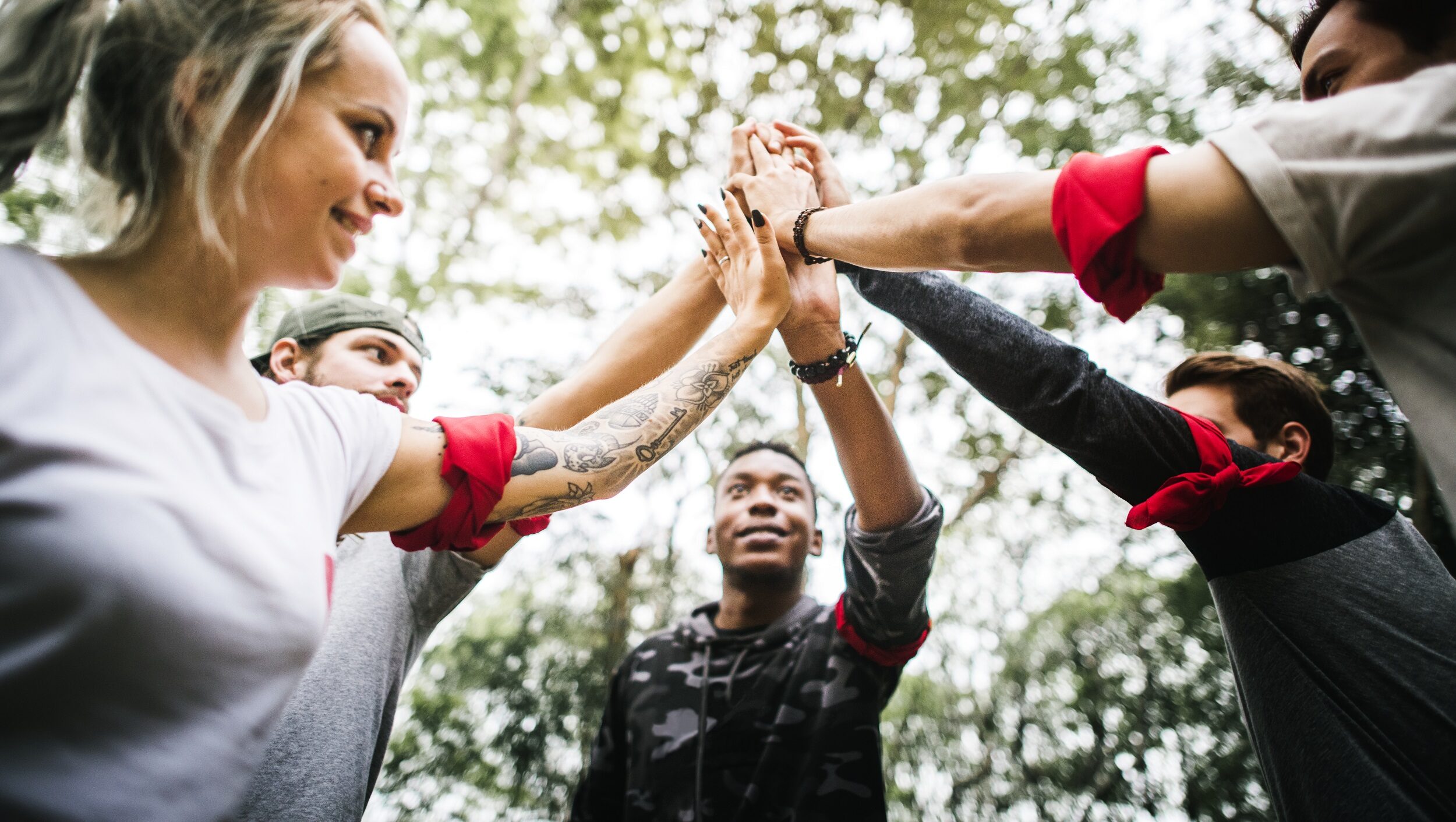 Group of people that give each other high five